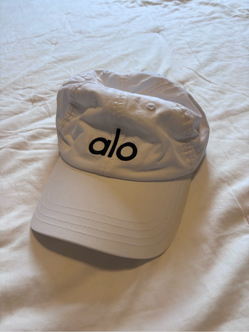 ALO Yoga Women’s White Cap with Black Logo